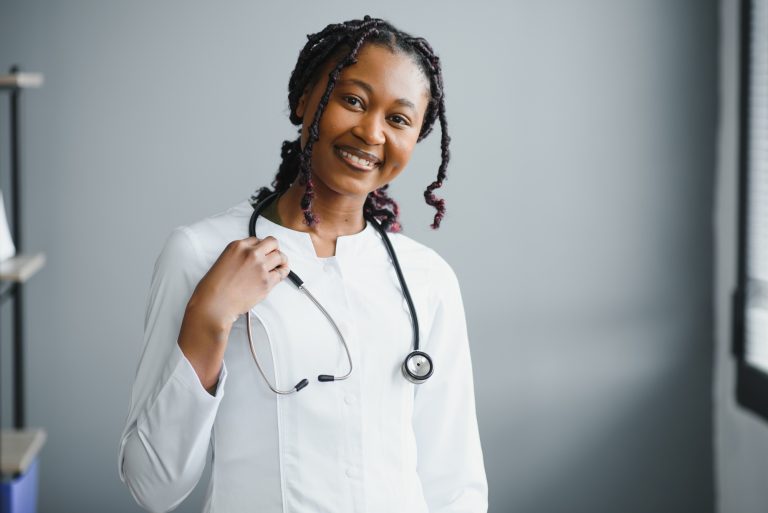 Portrait confident African female doctor medical professional
